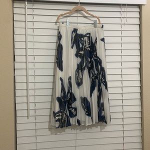 A pleated skirt with blue/ black flowers